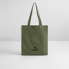 Tote Bag mit der Aufschrift  I BOW (Schleifensymbol in Herzform) CHEER in schwarz auf khakifarbenem Stoff. Der Beutel steht vor einer weißen Wand auf weißem Untergrund.