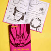 On yellow Background you see the book: CHEERLEADING FRIENDSHIP BOOK: for Juniors & Seniors. The Cover shows an illustration of arms showing a baskettoss with one person on the basketcross position. The Cover is Pink, yellow and Brown. The other book is open and shows the black and white design oft the book, that you can color.