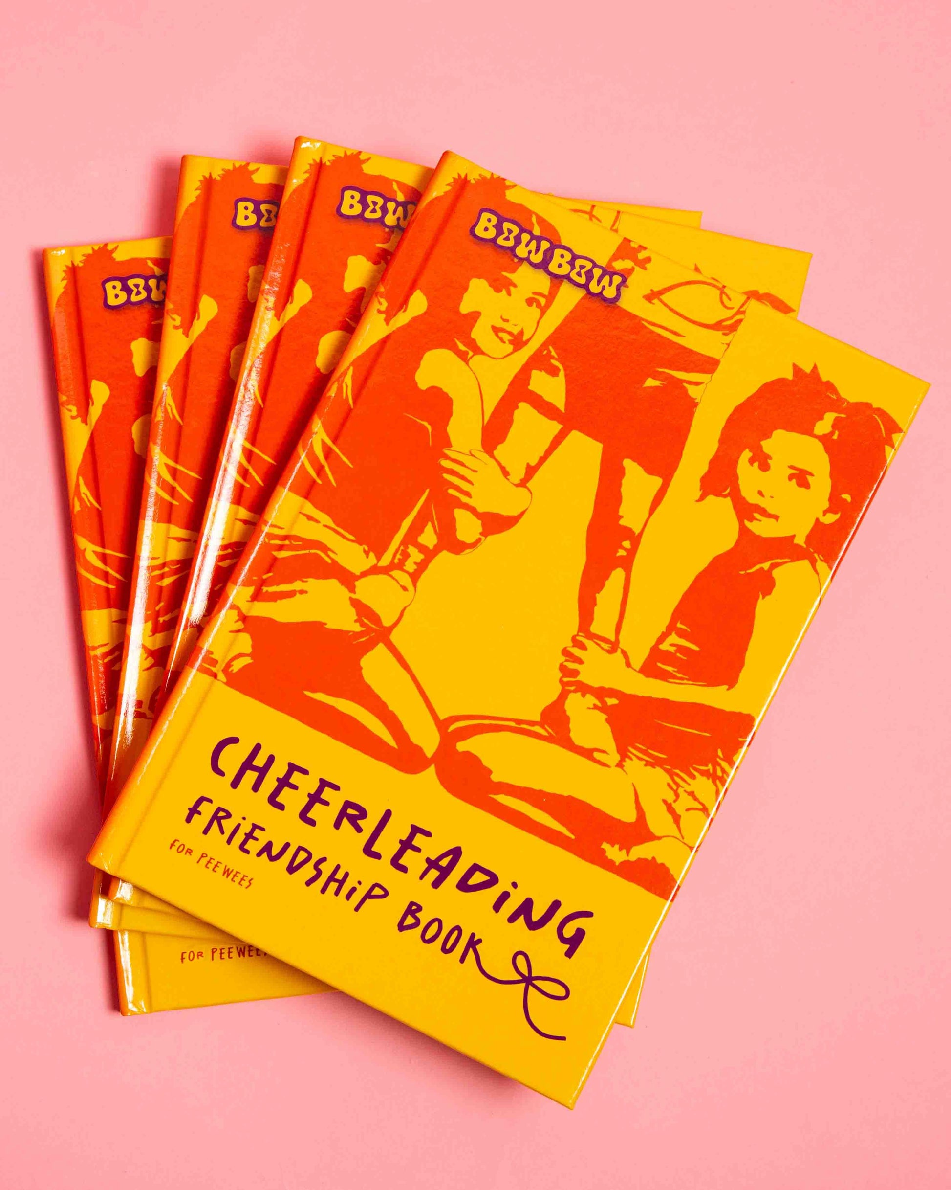 Cheerleading Friendship Book for Peewees. 4 Books on pink Background. You can see the Cover.