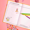Cheerleadingbook on a pink backgrpund. You can see some stickers and pencils.